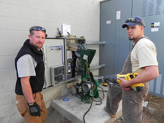 Second slide image Carnahan Electric Workers working on a commercial project