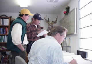 Three guys in the office Consulting