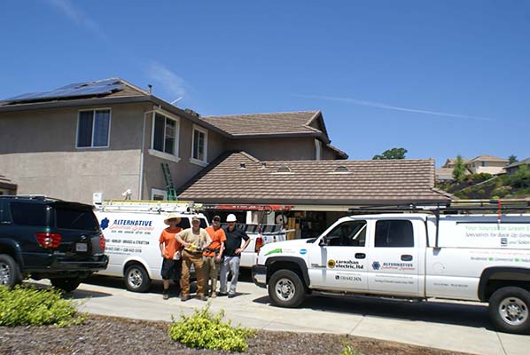 First slide image Carnahan Electric Crew in front of Residential House with company vehicles