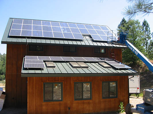 Slide image 10a roof mounted solar panels in process of being finished