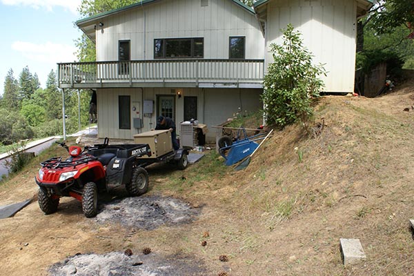 Second slide image generator on trailer in front of house